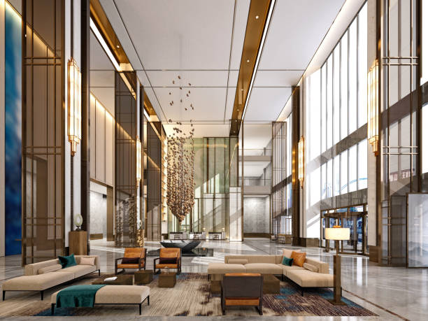 A luxurious hotel lobby with high ceilings, modern chandeliers, and elegant seating areas
